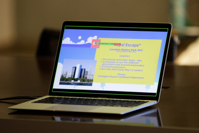 laptop showing slides for student presentation